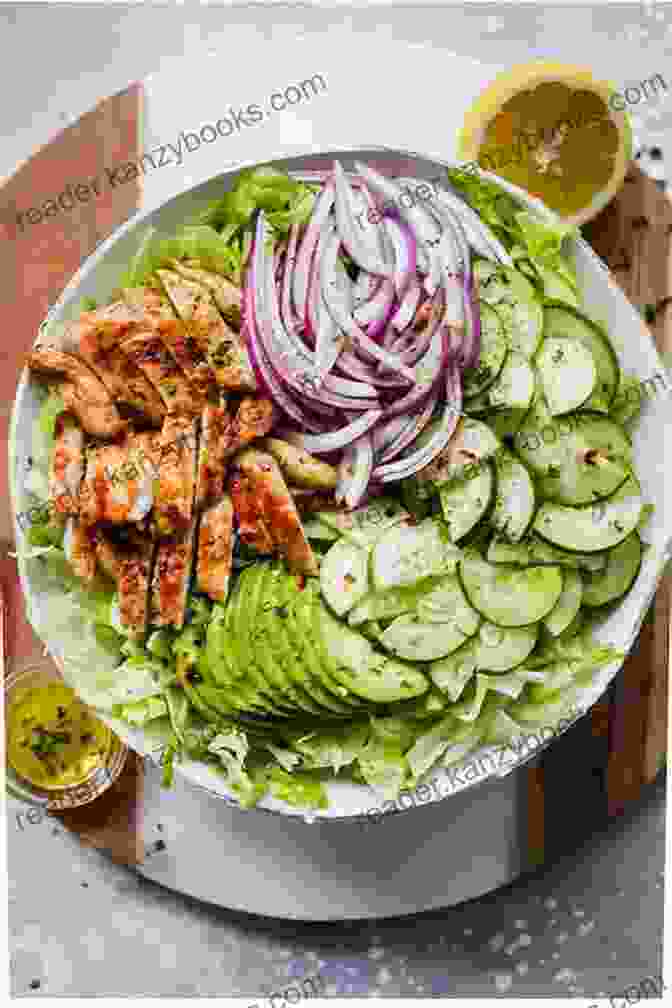 A Flavorful Plate Of Chicken And Avocado Salad Garnished With Fresh Herbs Good Food: Low Fat Feasts (BBC Good Food)