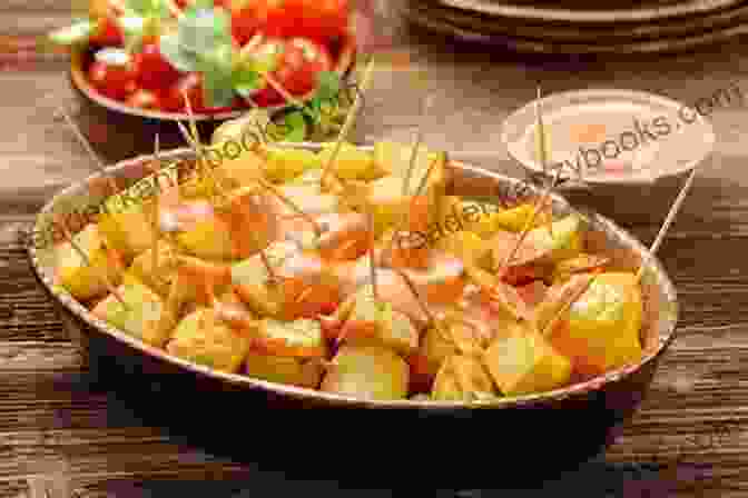 A Photo Of A Plate Of Patatas Bravas, Crispy Fried Potatoes Topped With A Spicy Tomato Sauce Original Tapas Cookbook For Everyone: Prepare Authentic Spanish Tapas With The Help Of This Cookbook