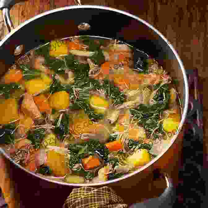 A Warm And Comforting Bowl Of Hearty Soup, Featuring A Rich Vegetable Broth, Tender Chunks Of Chicken, And Colorful Vegetables. MEDITERRANEAN DIET COOKBOOK: 100+ PERFECTLY PORTIONED RECIPES FOR HEALTHY EATING LIFELONG HEALTH (28 DAY DIET PLAN)